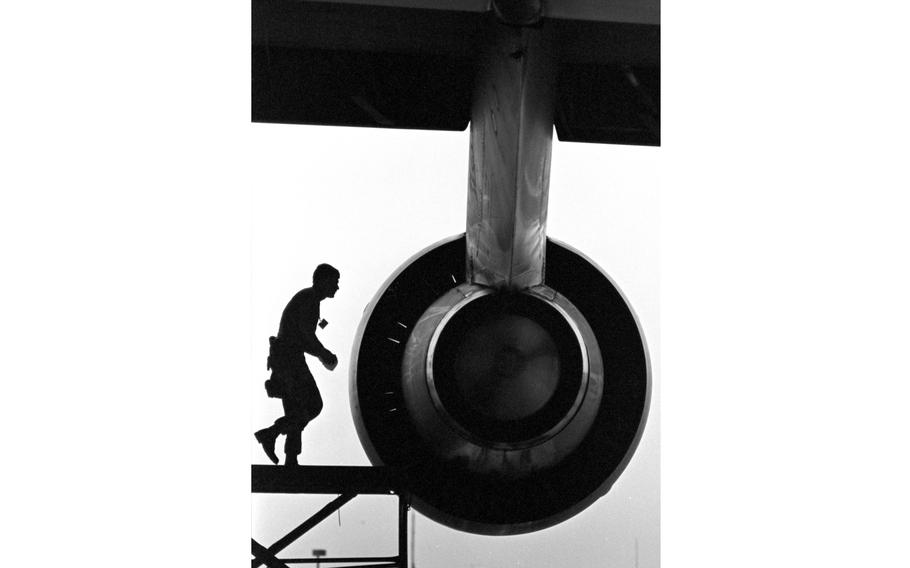 An airman services an aircraft