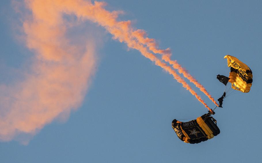 The Army’s Golden Knights parachute team performs before the Army 10 Miler Sunday, Oct. 9, 2022, at the Pentagon.