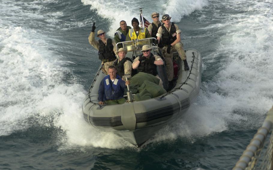 A boarding crew from USS Milius returns after running maritime interception operations in the Persian Gulf. Coalition forces continue to run down smugglers to enforce U.N. sanctions.