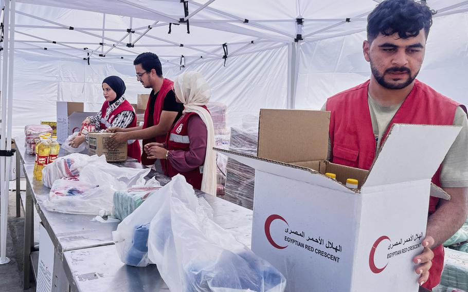 Egyptian Red Crecent members prepare humanitarian aid.