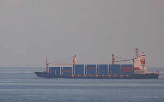The container ship, Kota Rahmat - with the destination 'VSL NO LINK ISRAEL' - approaches the Bab-el-Mandeb strait on Jan.18, 2024, in Obock, Djibouti. Many cargo ships crossing into the Red Sea are declaring that they have no links to Israel to avoid being targeted by Yemen’s Houthi rebel groups. Attacks on commercial ships by Yemen's Houthi rebel group, who say they are acting in protest of Israel's war in Gaza, have imperiled a vital global shipping route through the Bab-el-Mandeb strait that lies between Yemen and Djibouti and connects the Gulf of Aden and Red Sea. The disruption has forced more shipping companies to divert around the Horn of Africa, upending supply chains and increasing costs. (Luke Dray/Getty Images/TNS)