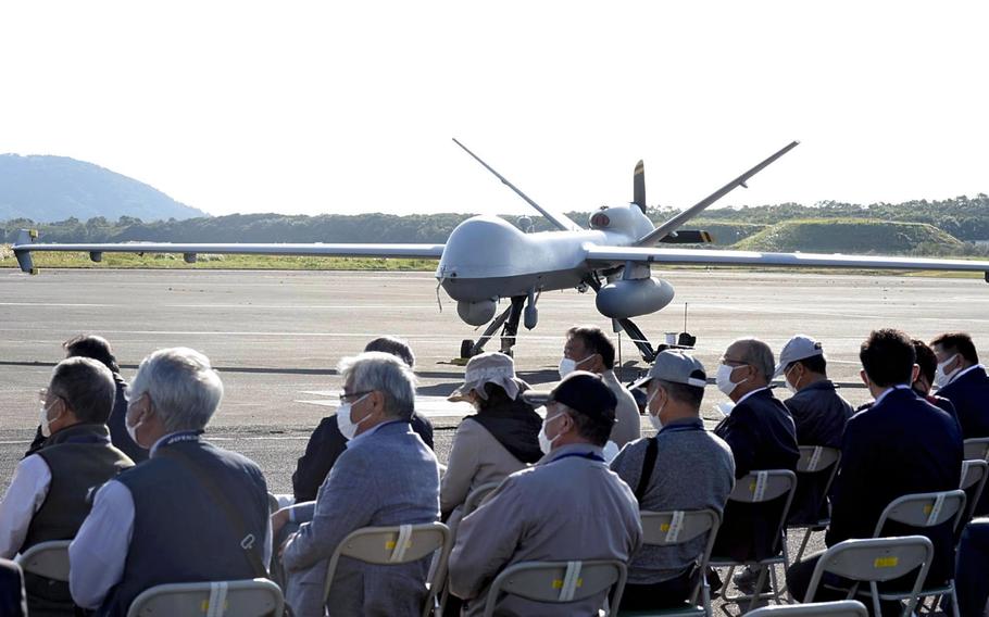 A U.S. military MQ-9 drone is shown to local officials during a demonstration flight at the Maritime Self-Defense Force’s Kanoya Air Base in Kanoya, Kagoshima Prefecture, on Nov. 5. 