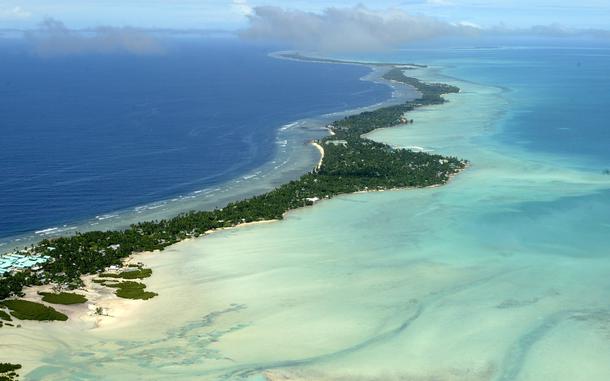 In this March 30, 2004, file photo, Tarawa atoll, Kiribati, is seen in an aerial view. Kiribati and several other small Pacific nations were among the last on the planet to have avoided any virus outbreaks, thanks to their remote locations and strict border controls. But their defenses appear no match against the highly contagious omicron variant.