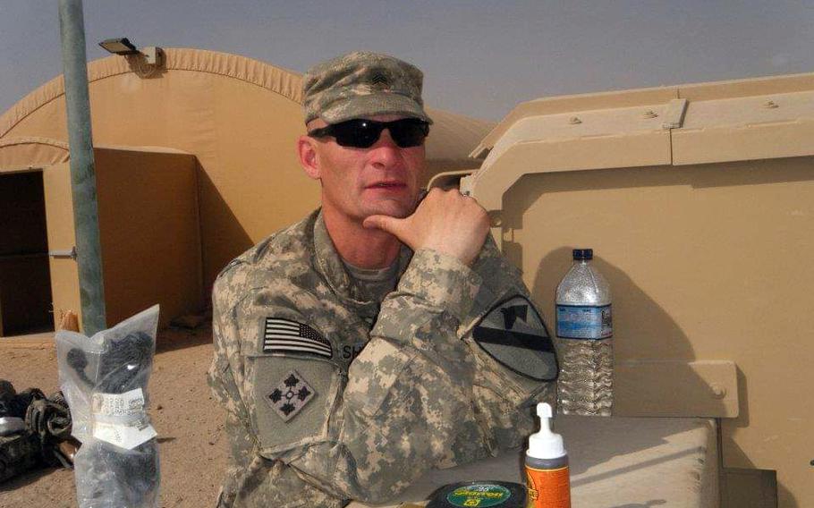 Sgt. Michael Ashby relaxes in Kuwait after finishing a deployment in Iraq in 2011. 