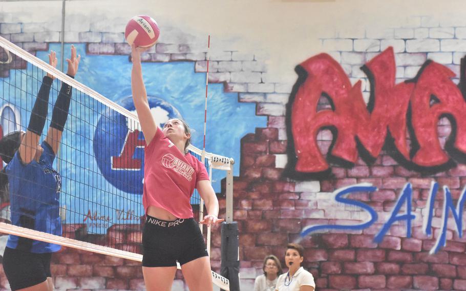 Aviano setter Mayci Salmon tries to surprise her Rota opponents by tipping the ball over the net instead of setting it in the Saints’ five-set loss to the Admirals on Saturday, Oct. 14, 2023.