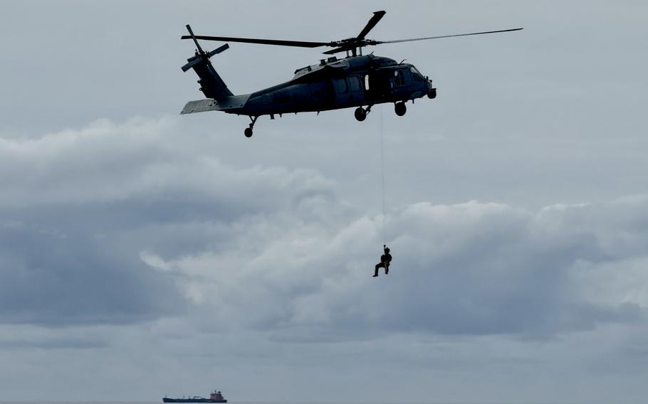 A Black Hawk helicopter lands drops off 