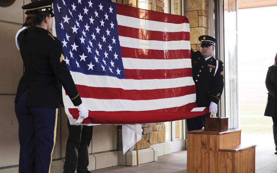 An American flag is folded during the memorial service for Army Spc. Michael J. Gilmer on Thursday, Nov. 18, 2021, at the Montana State Veteran’s Cemetery near the VA Medical Center at Fort Harrison, west of Helena, Mont.