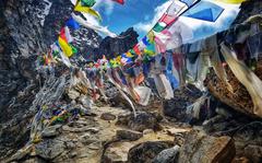 Prayer flags are strung across the summit of Renjo La Pass in the Himalayas. (Tarcy Connors/The San Diego Union-Tribune/TNS)