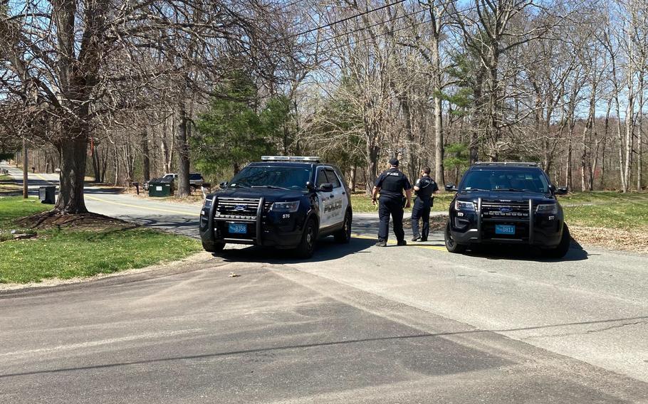 Police block a road in North Dighton, Mass., Thursday, April 13, 2023. 