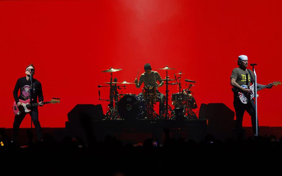 Mark Hoppus, left, drummer Travis Barker and Tom DeLonge of Blink-182 perform in San Diego on June 19. The band is scheduled to come to London and Birmingham, England, in October.