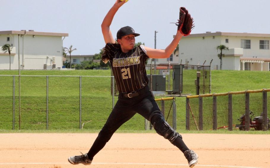 Humphreys right-hander Eunha Walker kicks and delivers during Monday's Far East Division I softball tournament. The Blackhawks beat Nile C. Kinnick 30-16 and lost 13-10 to American School In Japan.