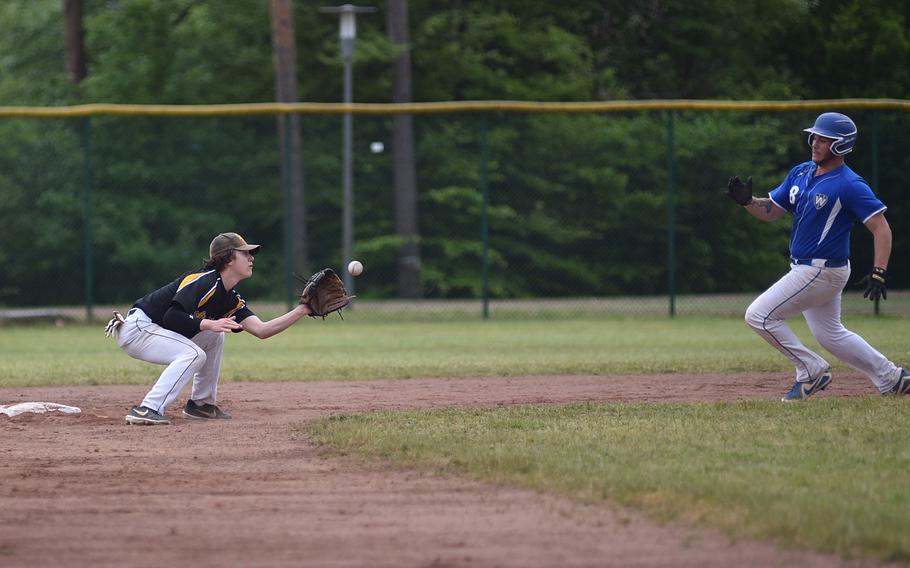 Stuttgart second baseman Blake Rossignol receives the throw from home plate as Wiesbaden senior Andrew Meno tries to steal during a Division I DODEA European baseball semifinal on May 19, 2023, at Southside Fitness Center on Ramstein Air Base, Germany.