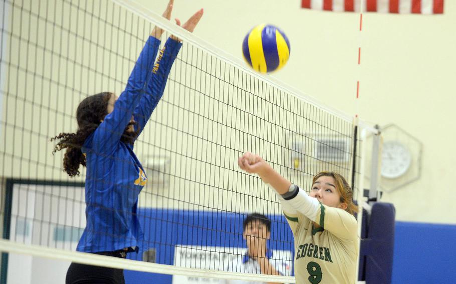 Robert D. Edgren's Saige Whitmore bumps the ball at the net against Yokota's Arianna Holmes during Saturday's DODEA-Japan girls volleyball match. The Panthers won in three sets Saturday and four sets Friday.