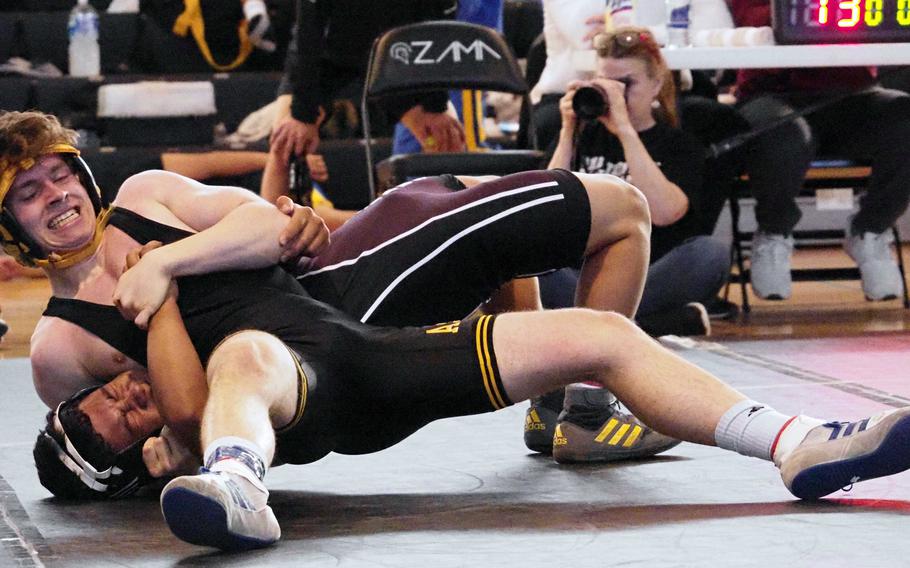 American School In Japan 127-pounder Toby Wilcox locks in a head-and-arm hold on Zama American's Gabriel Simpkins during Saturday's Zama Invitational. Wilcox placed second and Simpkins third.