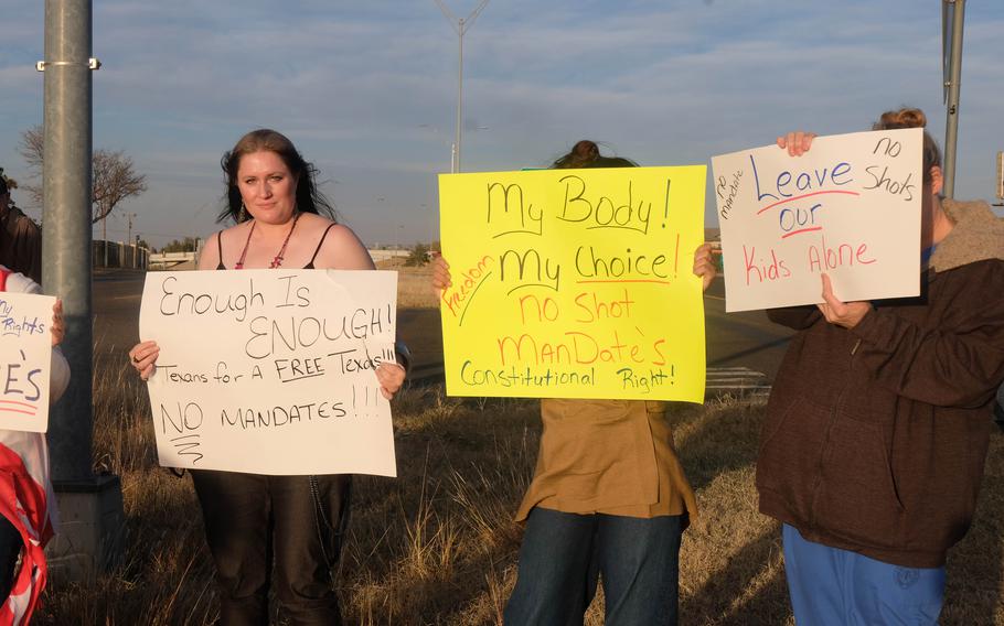 Local opponents of vaccine mandates gather outside of Thomas E. Creek VA Medical Center in Amarillo, Texas, on Friday Nov. 19, 2021.