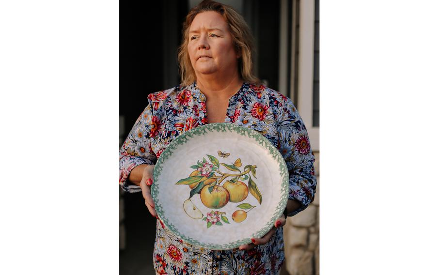 Mary Lyn Martinez holds a special gravy boat that has graced her Thanksgiving table for many years on Thursday, Nov. 18, 2021 in Acton, Calif.