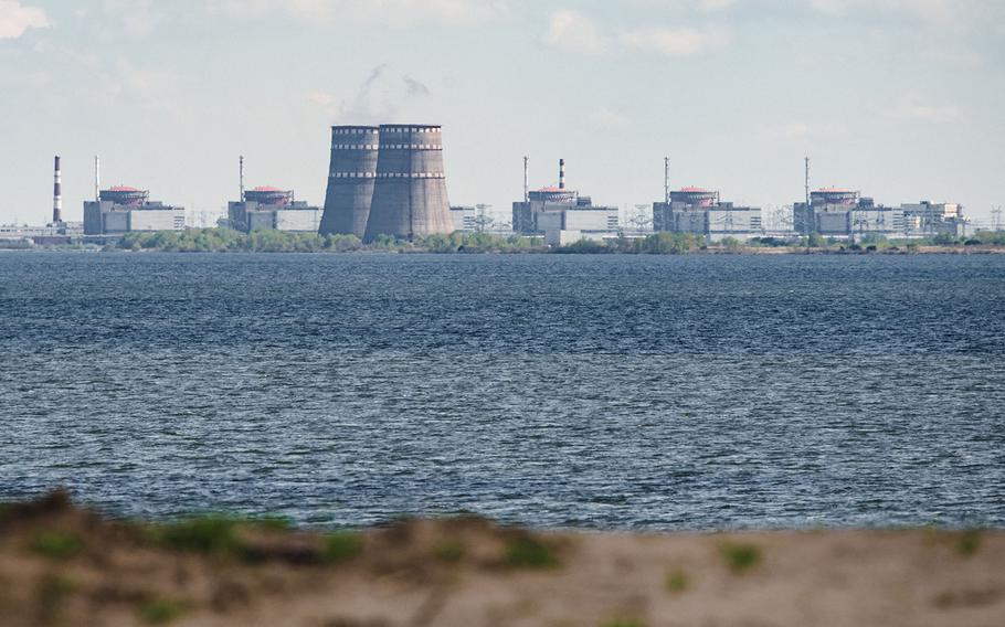 A general view shows the Zaporizhzhia nuclear power plant, situated in the Russian-controlled area of Enerhodar, seen from Nikopol in April 27, 2022.
