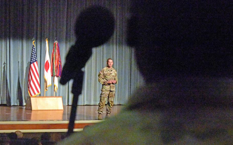 Sgt. Maj. of the Army Michael Grinston answers a soldier's question during a town hall meeting at Kadena Air Base, Okinawa, Monday, Nov. 21, 2022.