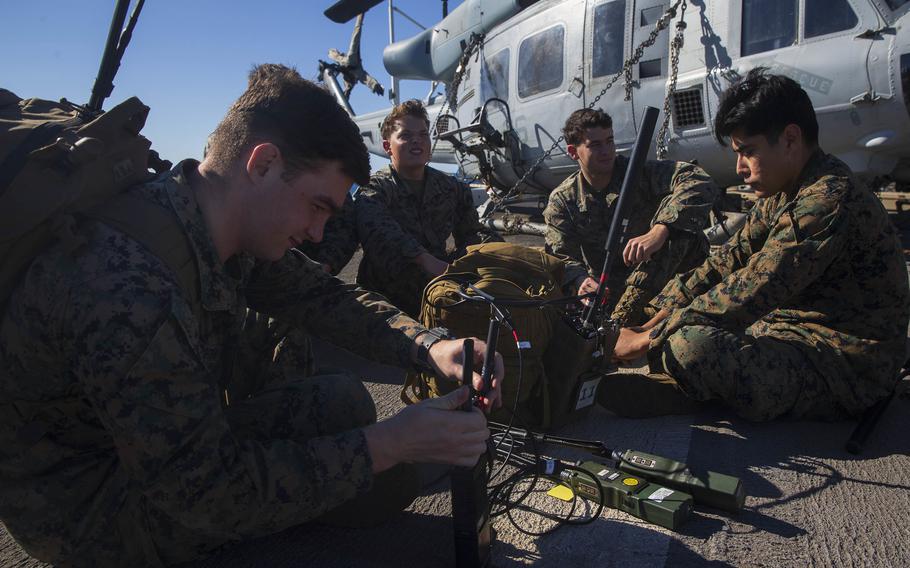Marines aboard the USS New Orleans prepare to launch a backpackable electronic attack module, or BEAM, in the Coral Sea, July 25, 2021. The system can detect the radio frequency of a specific threat, a hostile drone, for example, locate it and take it out.