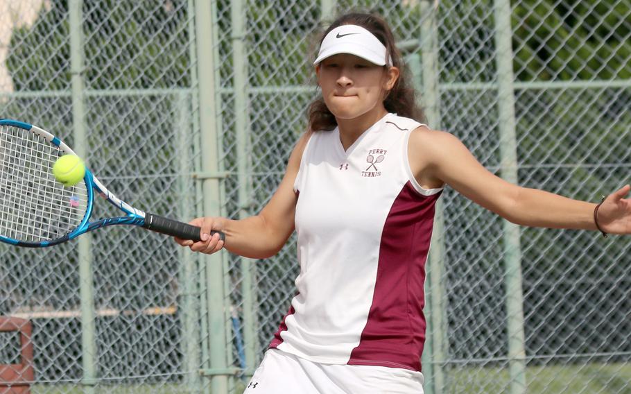 Matthew C. Perry’s Sasha Malone smacks a forehand return during Saturday’s DODEA-Japan tennis matches. Malone teamed with Ivanelis Nieves-Bermudez in a 6-3 loss to Yokota’s Giselle Pinard and Vita Duran in doubles.