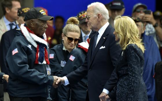 President Joe Biden shakes hands with World War II veteran Calvin Shiner during the D-Day 80th Anniversary commemoration at Normandy American Cemetery in Colleville-sur-Mer, France on June 6, 2024. Shiner was awarded the Legion of Honor by French President Emmanuel Macron.