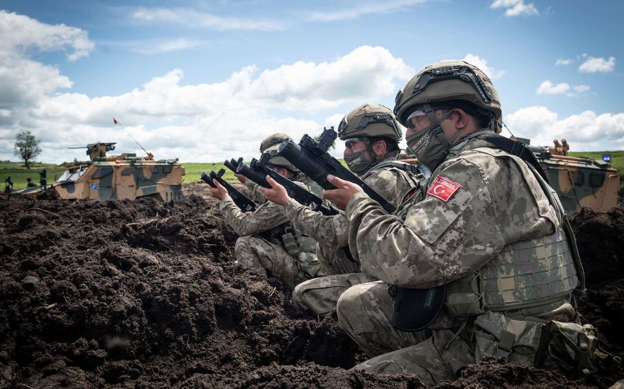 Turkish soldiers fire the AK40-GL Bombaatar during exercise Steadfast Defender near Cincu, Romania, May 23, 2021. NATO officials are planning to bring together more than 40,000 troops for the exercise in 2024.