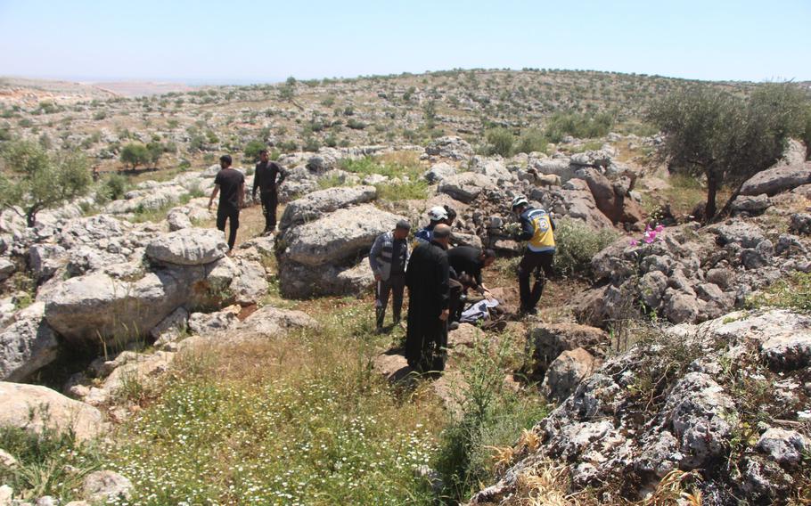 The Syria Civil Defense, also known as the White Helmets, recover the body of Lutfi Hassan Masto who was killed by a US drone strike on May 3, 2023.