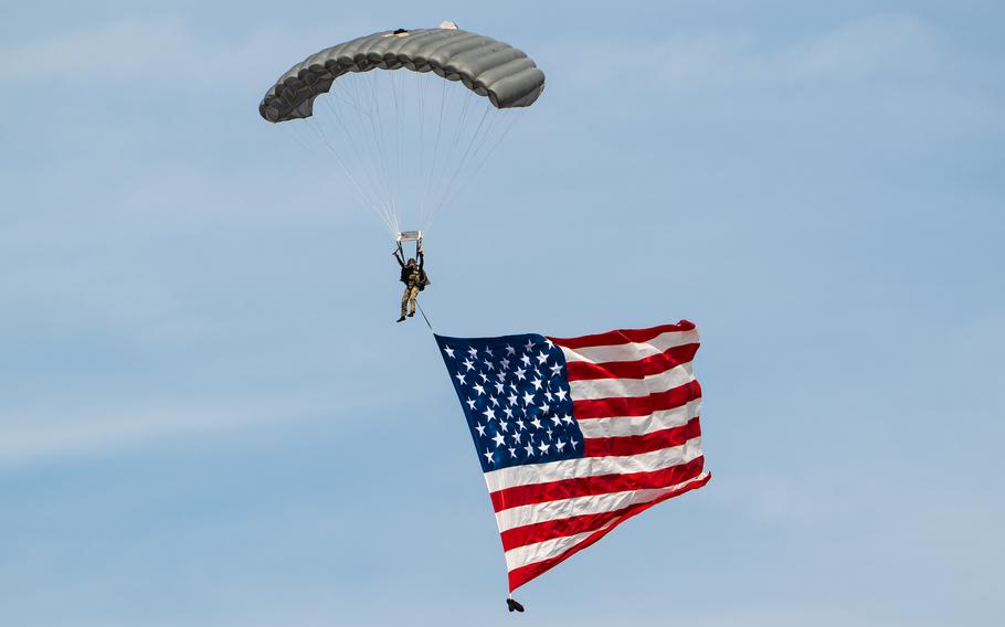 A pararescueman from the Kentucky Air National Guard’s 123rd Special Tactics Squadron parachutes into the Ohio River as part of a demonstration during the Thunder Over Louisville air show in Louisville, Ky., Saturday, April 20, 2024.
