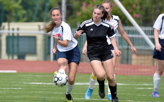 Aviano’s Kylee Carol sends the ball upfield as Vicenza’s CeCe Janssens defends in the girls Division II final at the DODEA-Europe soccer championships in Kaiserslautern, Germany, May 19 2022. Vicenza defeated Aviano 2-0 to take the title.