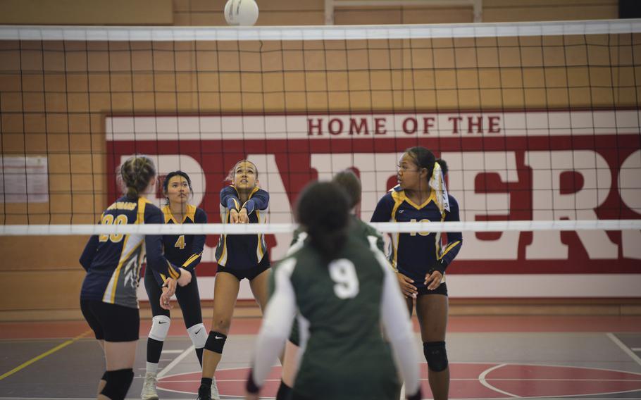 Ansbach Cougar Laila McIntyre deftly digs the ball with teammate Kyla Tuazon at her left side during the DODEA Division III European volleyball semifinals on Oct. 27, 2023, in Kaiserslautern, Germany.