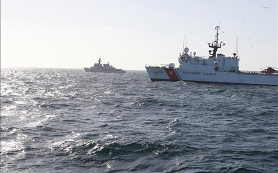 U.S. Coast Guard cutter Thetis, right, and the Moroccan coast guard rescue two migrant rafts in the Atlantic Ocean on Jan. 5, 2022. 