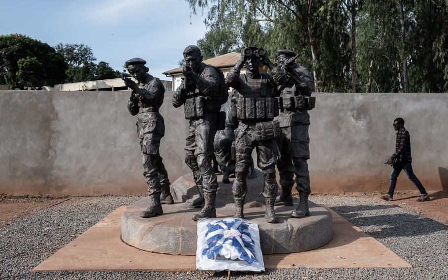 A bouquet is laid at the foot of a statue depicting Russian military instructors in Bangui, Central African Republic’s capital, days after last year’s death of the Wagner Group’s leader, Yevgeniy Prigozhin.  