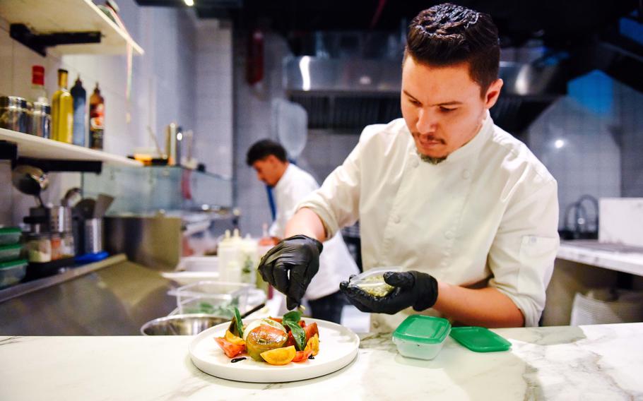 A chef makes a salad