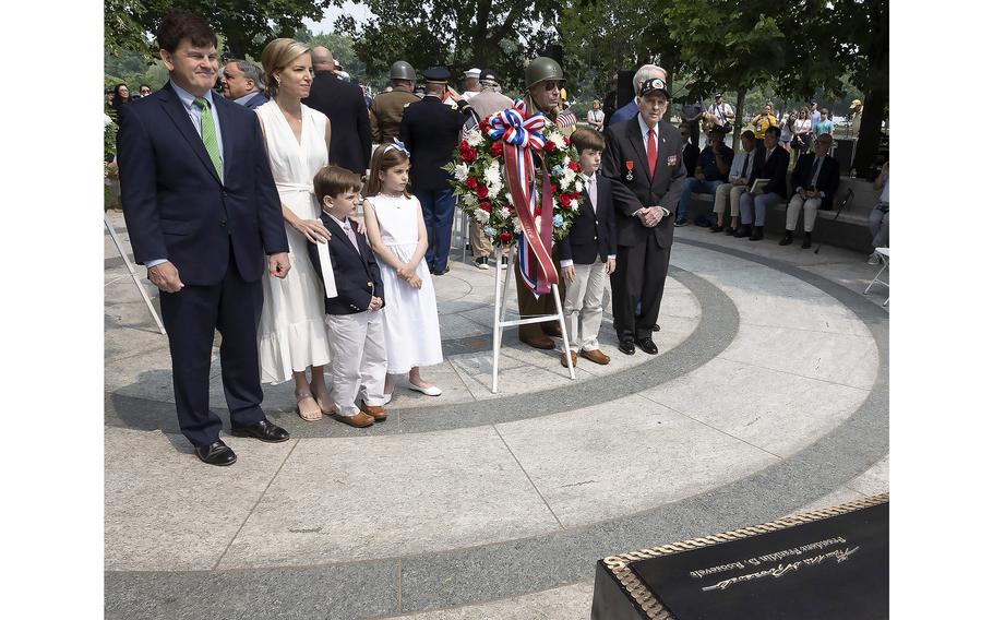 Roosevelt family members stand behind FDR’s signature on the new prayer plaque at the National World War II Memorial in Washington, D.C., on the 79th anniversary of the start of the D-Day invasion, Tuesday, June 6, 2023.