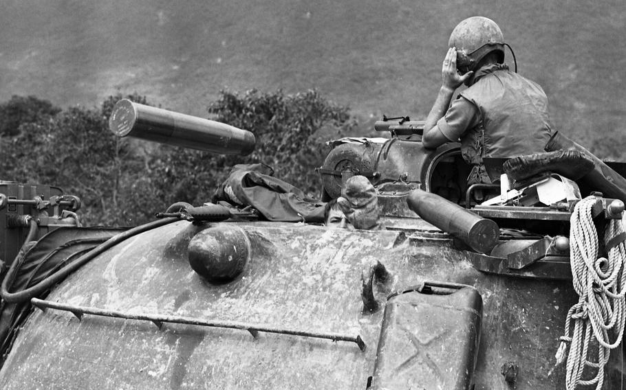 A tank loader throws spent shell casings out of his M48 tank in 1968. A combined Infantry and Cavalry mission was halted when the North Vietnamese opened up with 75mm recoilless, 50 caliber and AK-47 rifles, hitting one Armored Personnel Carrier (APC) twice, blowing off its tracks, and disabling a tank. The action took place about 2,000 meters from Landing Zone Ross, north of Chu Lai. 