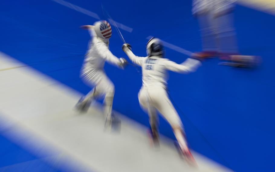 A U.S. women’s Olympic fencing team cadet athlete, Amanda Pirkowski, left, spars with Olympian Kelley Hurley inside Lotus Culture Center Arena at the Atago Sports Complex in Iwakuni, Japan, July 16, 2021.