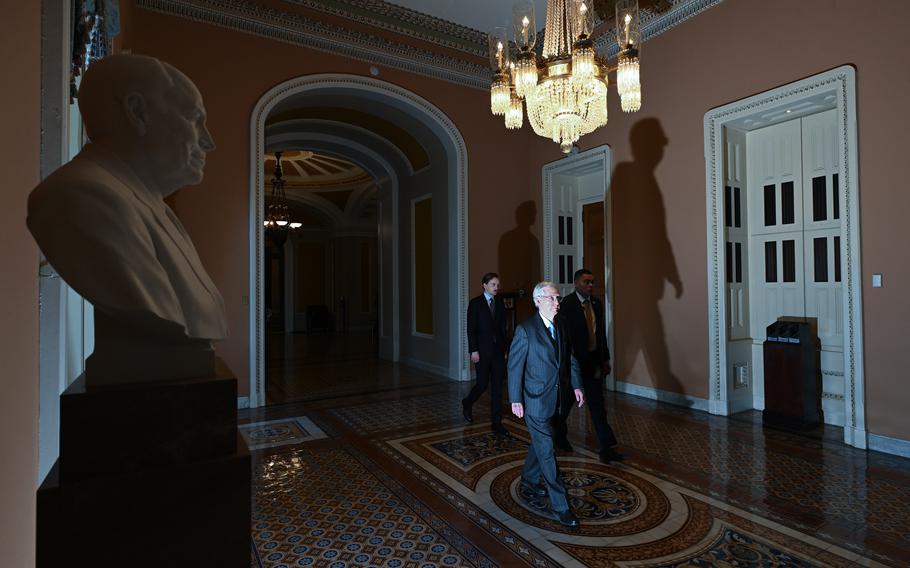 Senate Minority Leader Mitch McConnell (R-Ky.) walks back to his office from the Senate floor on Feb. 1, 2024. 