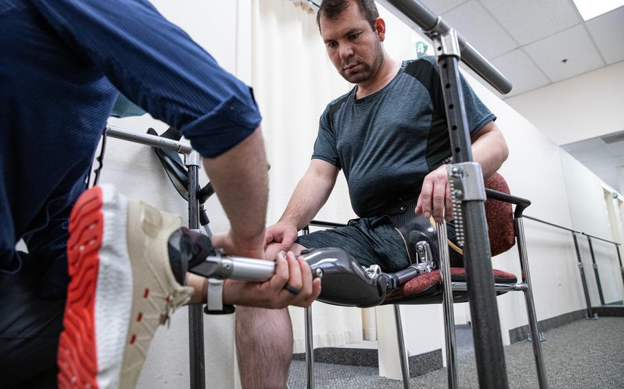 Tabesh with his new prosthetic leg during a fitting session in November at a rehabilitation facility in Linthicum Heights, Md.