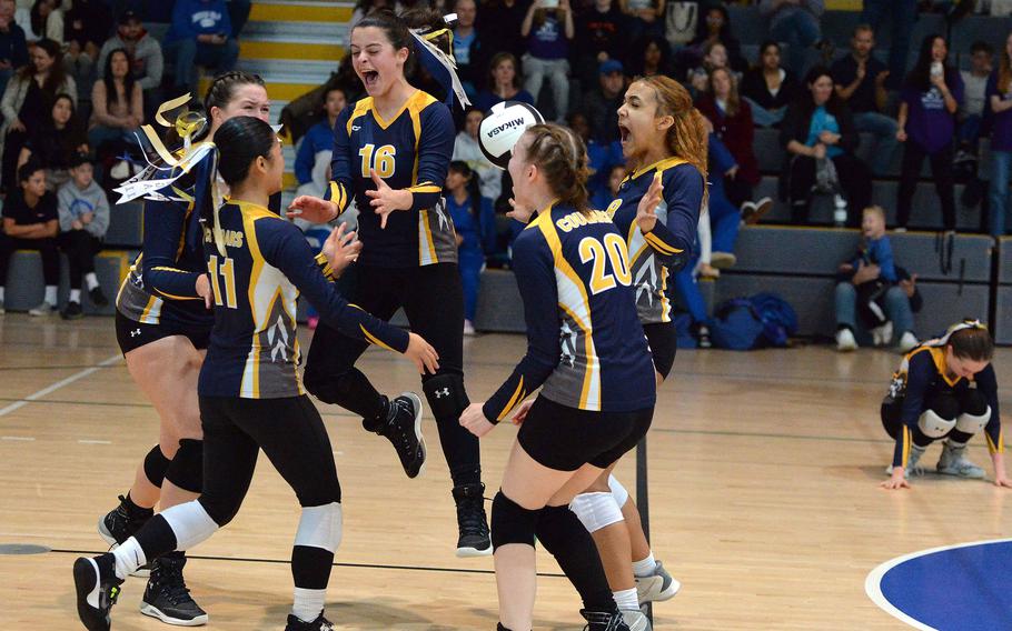 The Ansbach Cougars celebrate their DODEA-Europe Division III volleyball title after defeating Brussels 25-21, 17-25, 25-20, 25, 20, at Ramstein, Germany, Oct. 28, 2023.