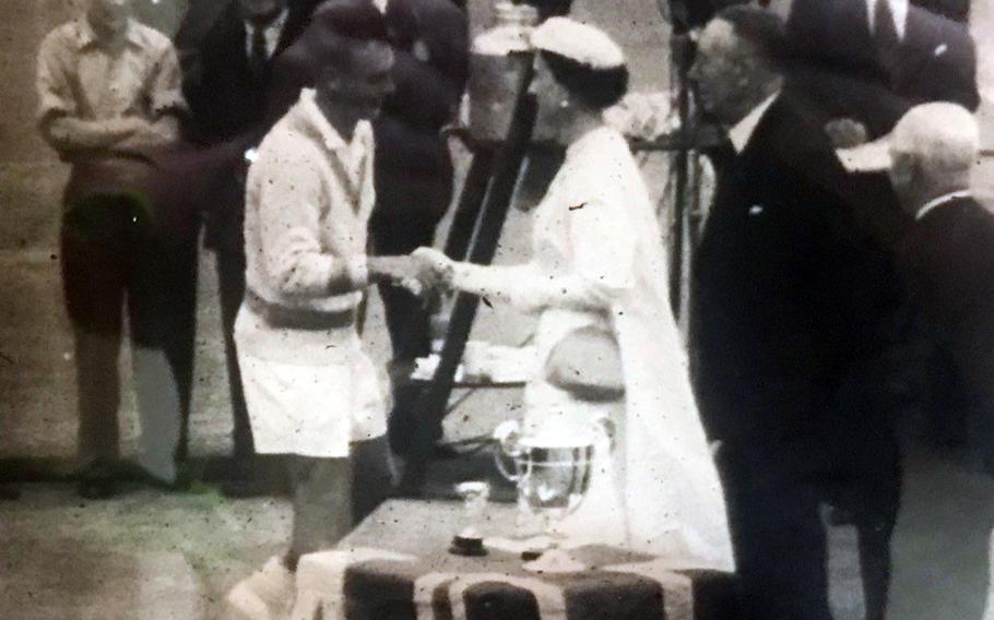 The duchess of Kent presents the Wimbledon trophy to Vic Seixas in 1953.