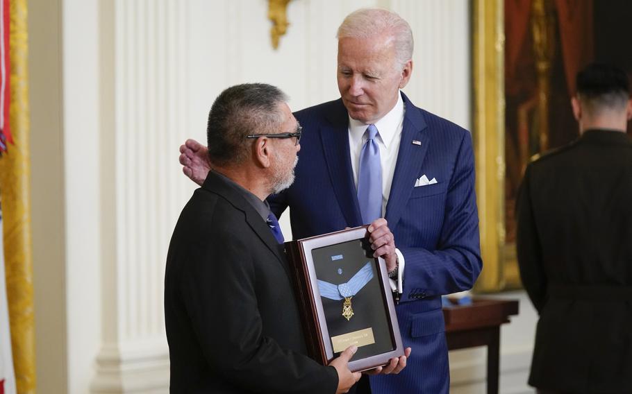 President Joe Biden on Tuesday, July 5, 2022, presents the Medal of Honor to John Kaneshiro, who accepted the posthumous recognition for his father Staff Sgt. Edward Kaneshiro during a ceremony in the East Room of the White House in Washington. Kaneshiro received the award for his actions on Dec. 1, 1966, during the Vietnam War.