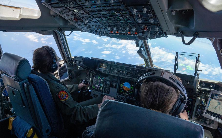 Capt. Nichole McCarthy and Maj. Abby Gromowsky, 535th Airlift Squadron pilots, complete a training mission at Joint Base Pearl Harbor-Hickam, Hawaii, on March 23, 2022. Eligible mobility pilots now stand to earn up to $420,000 in incentive payments for reupping with the Air Force.