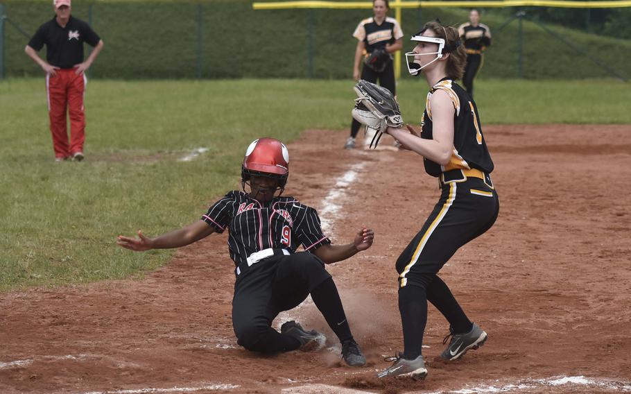 Kaiserslautern senior Loren Martin slides into home against Stuttgart during the DODEA-Europe softball championship semifinal May 23, 2024, on Ramstein Air Base, Germany. Kaiserslautern won 5-3.