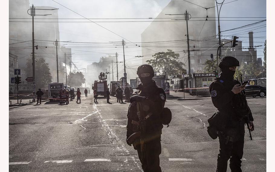 Ukrainian police block a road after an October drone attack in the capital, Kyiv. 