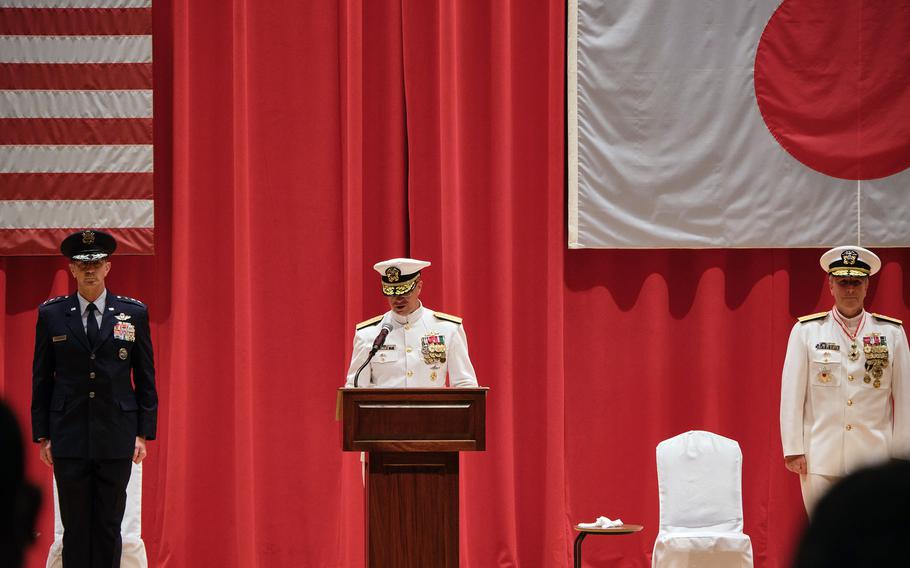 Rear Adm. Carl Lahti speaks after taking the helm of U.S. Naval Forces Japan and Navy Region Japan at Yokosuka Naval Base, Japan, Wednesday, July 14, 2021. He is flanked by the outgoing commander, Rear Adm. Brian Fort, and Air Force Lt. Gen. Kevin Schneider, commander of U.S. Forces Japan. 