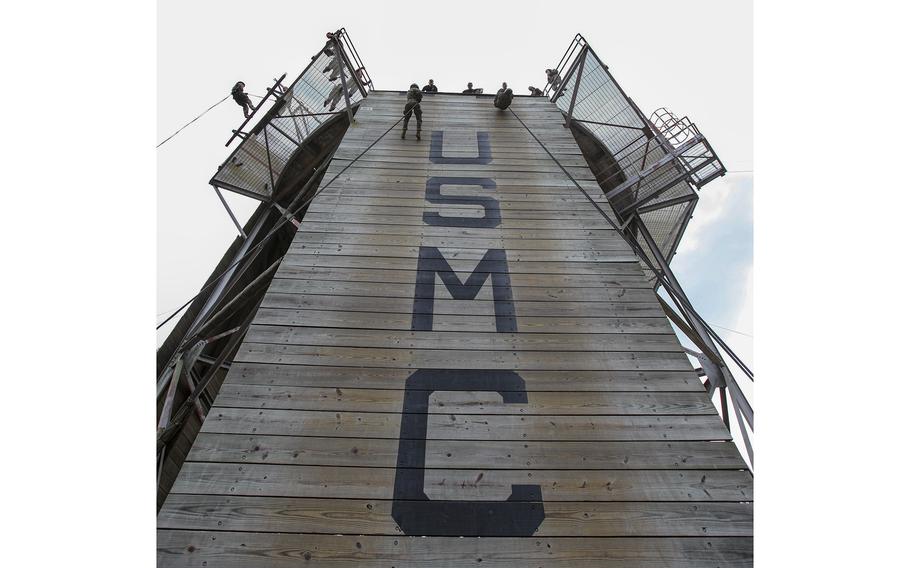 U.S. Marine Corps recruits with November Company, 4th Recruit Training Battalion, Recruit Training Regiment, execute the rappel tower aboard Marine Corps Recruit Depot Parris Island, S.C., Nov. 27, 2012. 