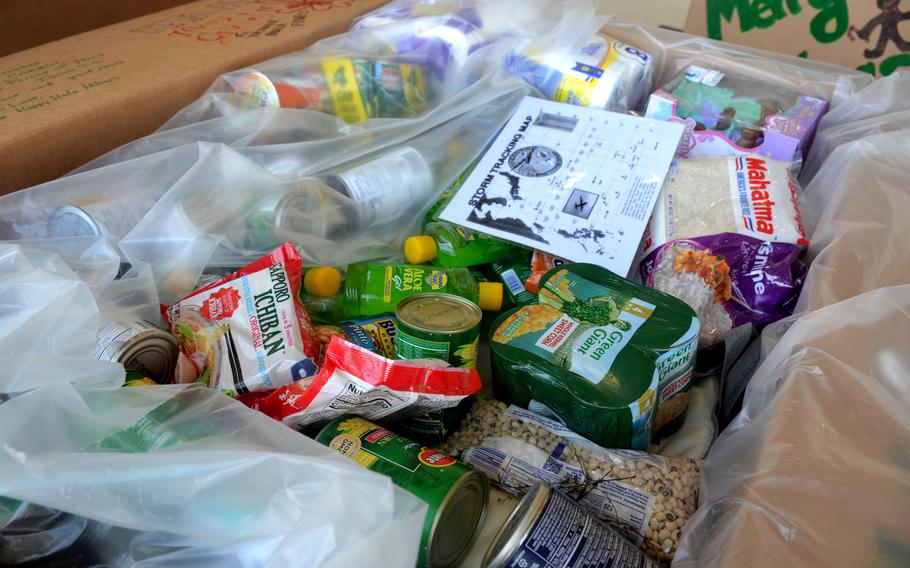 An Operation Christmas Drop bundle is filled with supplies inside a hangar at Andersen Air Force Base, Guam, Monday, Dec. 5, 2022. 