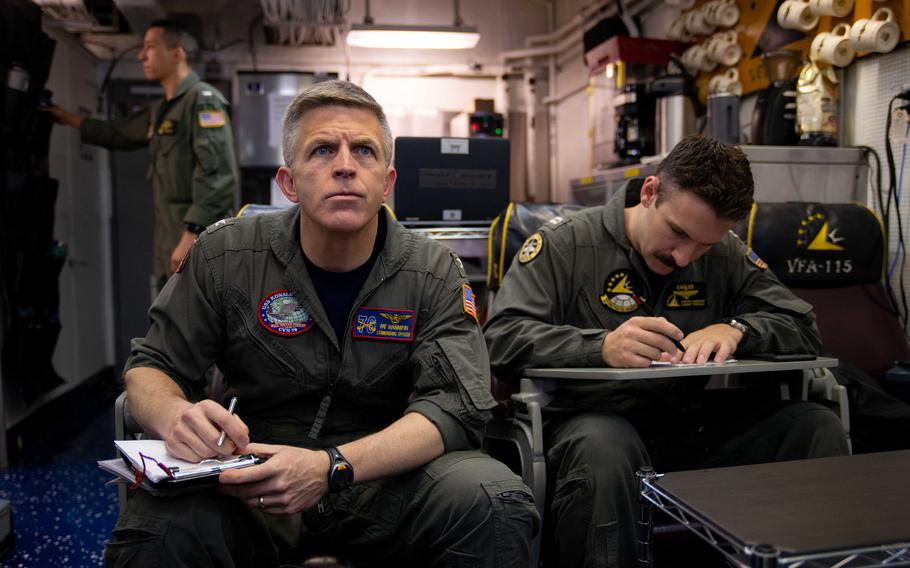 Then-USS Ronald Reagan commander Capt. Patrick Hannifin attends a pre-flight brief with Strike Fighter Squadron 115 pilots in the Philippine Sea, May 29, 2019.
