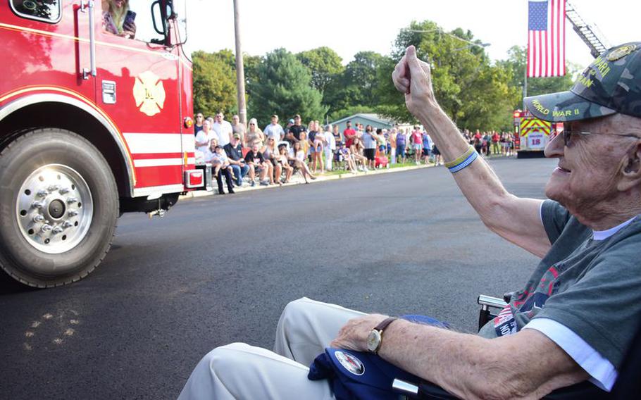 Folks lined the streets of Hampton on Labor Day in Hunterdon County to watch a procession of emergency vehicles, marchers and a pipe band taking part in a celebration of Hampton resident Bob “Gibby” Gibson, who turned 100.