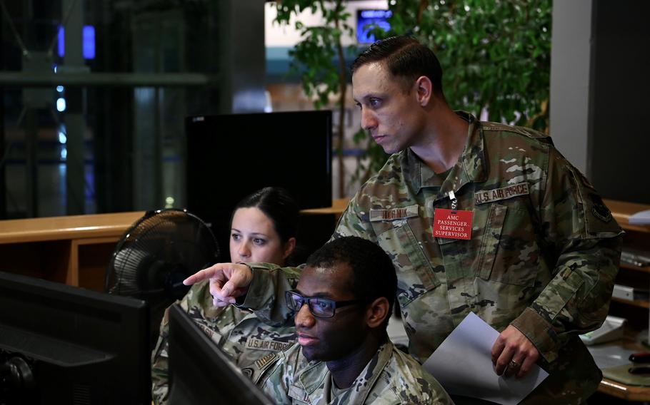 Air Force Staff Sgt. Stephen Hornik, a passenger services supervisor assigned to the 721st Aerial Port Squadron, directs airmen at the passenger terminal at Ramstein Air Base, Germany, Oct. 25, 2023. Hornik's heroics earlier that month saved the life of an unconscious man and inspired co-workers to become more adept at CPR.